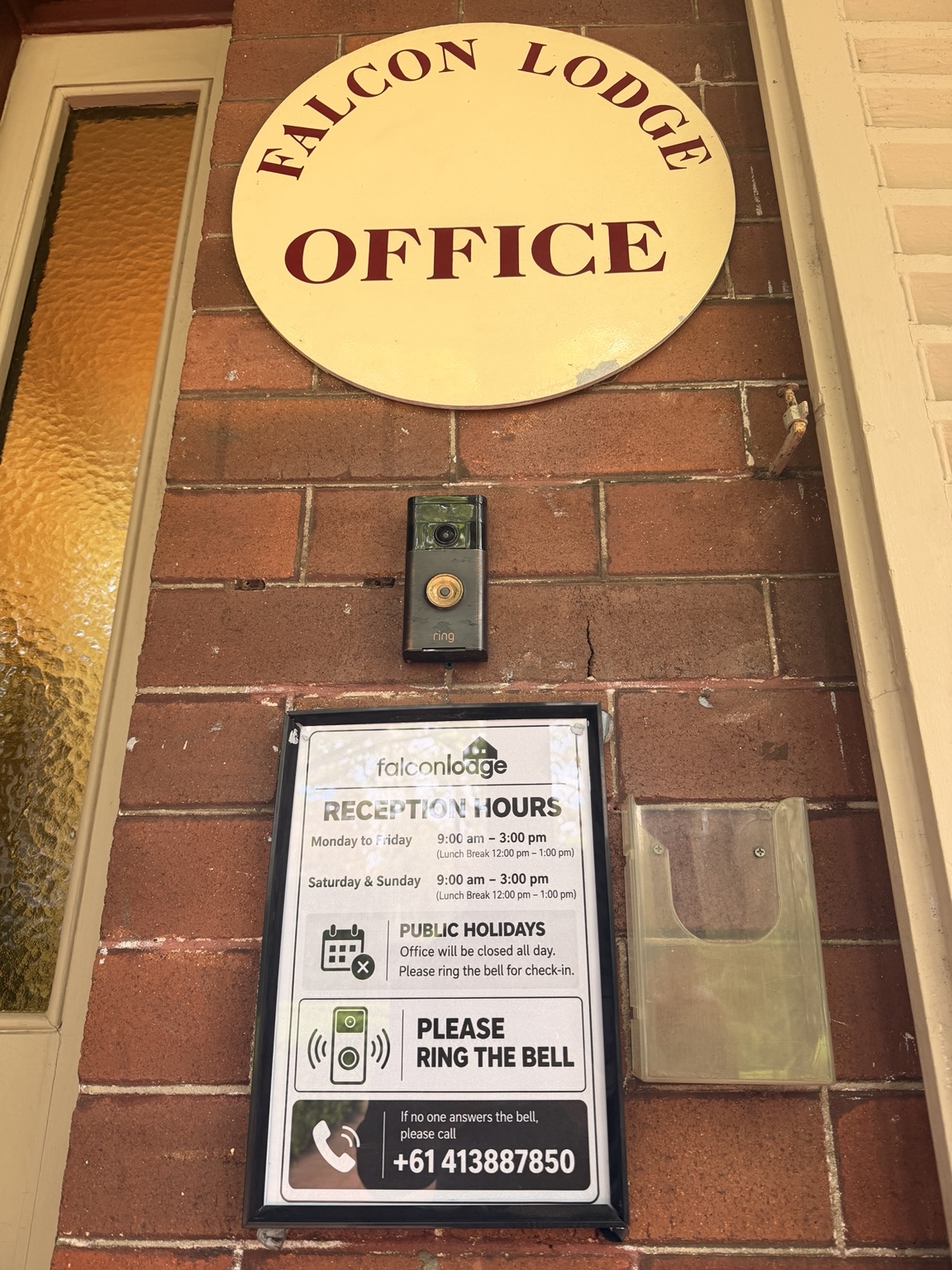 Falcon Lodge office sign, Ring doorbell and reception hours notice